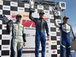 Lawson Aschenbach at the top of the Pirelli World Challenge GTS Class Podium, at the 2018 Grand Prix of St Petersburg 