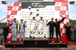 Sebastian Priaulx and Scott Maxwell at the top of the British GT podium at Oulton Park