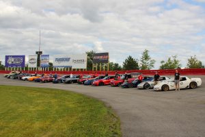 Forgeline customers lined up in front of the Forgeline billboard, at UMI Motorsports Park