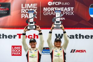 Robin Liddell and Frank DePew on the IMSA Michelin Pilot Challenge Lime Rock GS Podium